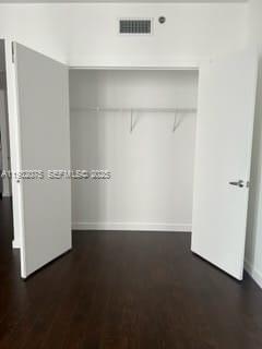 1050 Brickell Avenue, Unit 3122 Miami, FL 33131 - Photo 7 of 31 an empty room with wooden floor
