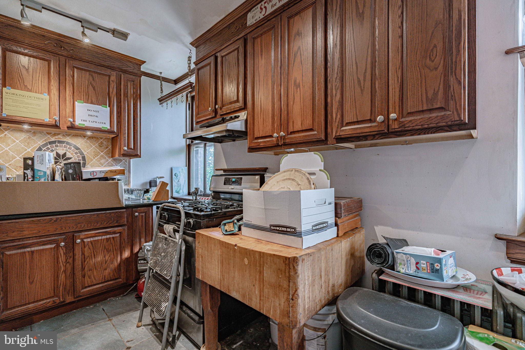 6230 Main Street Center Valley, PA 18034 - Photo 12 of 33 a view of a kitchen with chair and cabinets