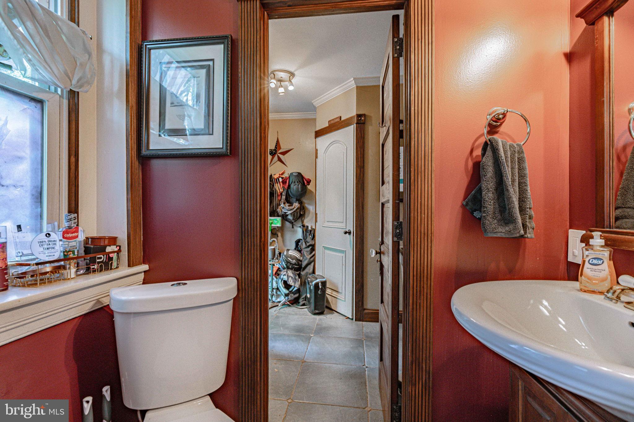 6230 Main Street Center Valley, PA 18034 - Photo 14 of 33 a bathroom with a sink a toilet a mirror and shower