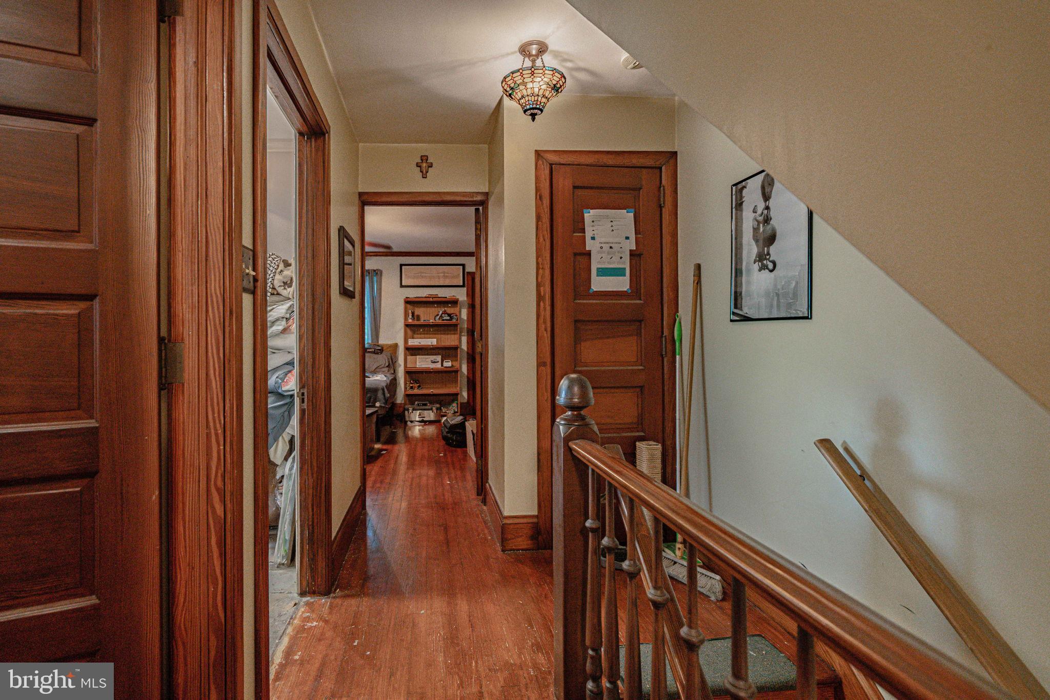 6230 Main Street Center Valley, PA 18034 - Photo 16 of 33 a view of a hallway with wooden floor and staircase
