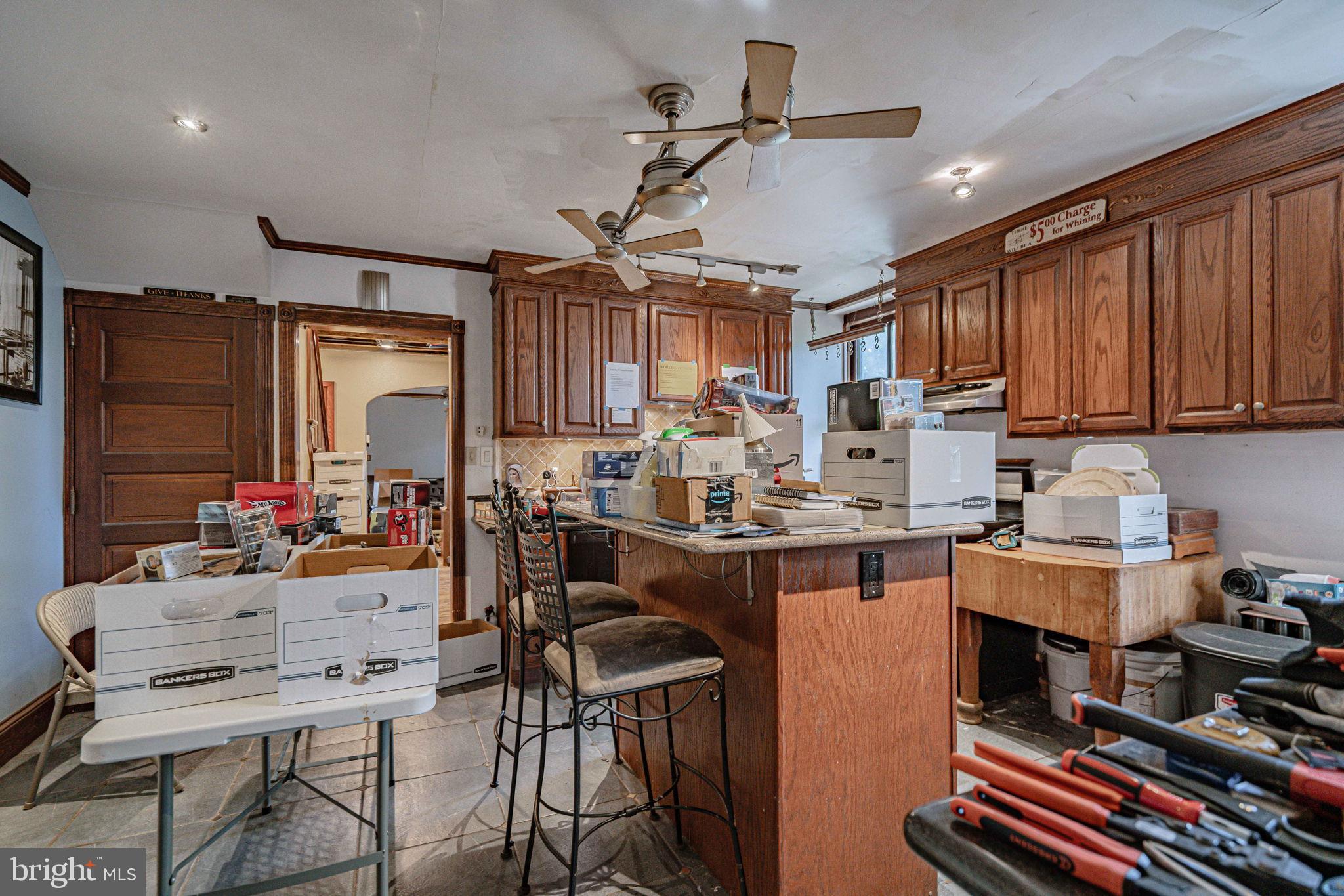 6230 Main Street Center Valley, PA 18034 - Photo 10 of 33 a kitchen with stainless steel appliances kitchen island granite countertop a sink and cabinets