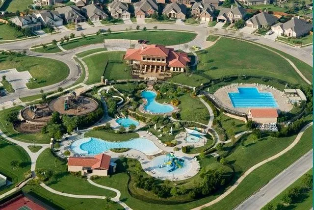 an aerial view of a swimming pool and outdoor space