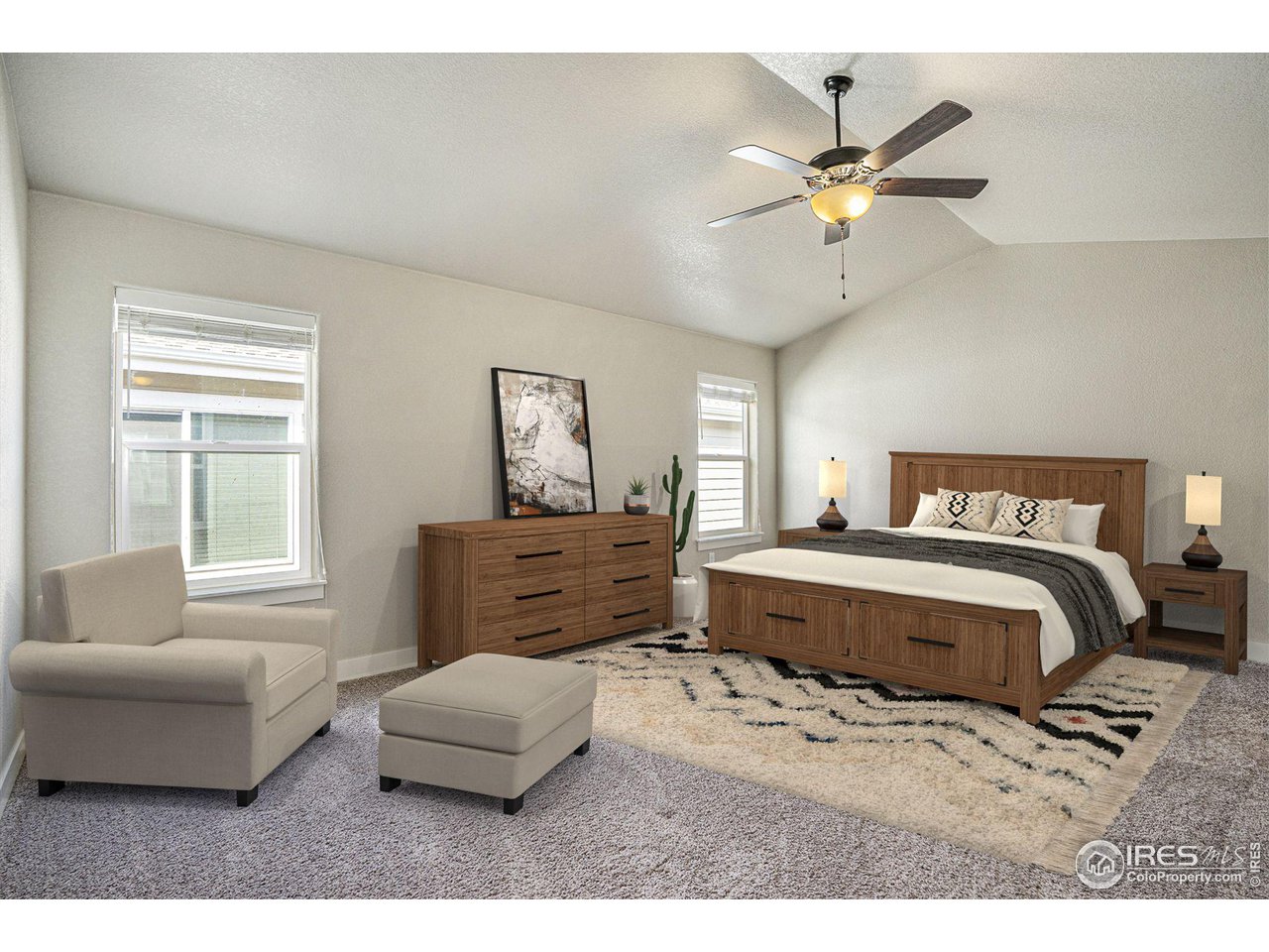 619 Davis Drive Frederick, CO 80530 - Photo 11 of 24 a bedroom with a large bed and a couch