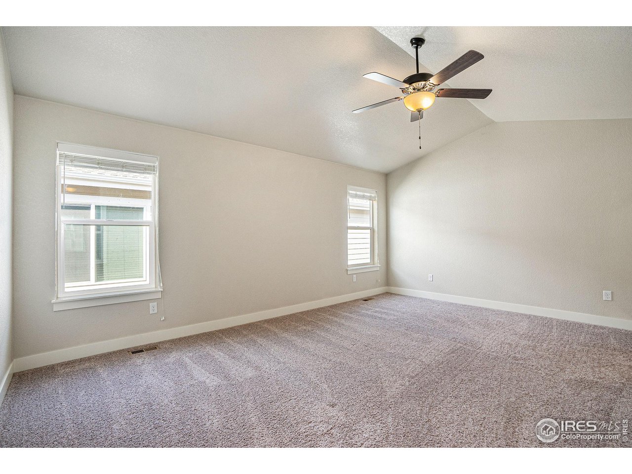 619 Davis Drive Frederick, CO 80530 - Photo 12 of 24 a view of an empty room with a window