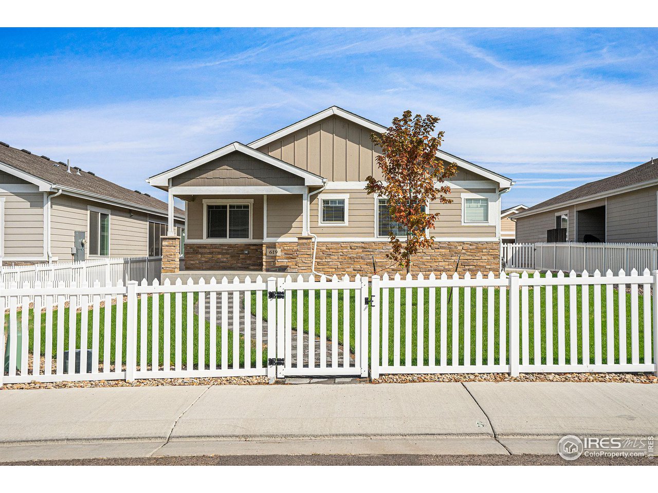 619 Davis Drive Frederick, CO 80530 - Photo 22 of 24 a front view of a house with a porch