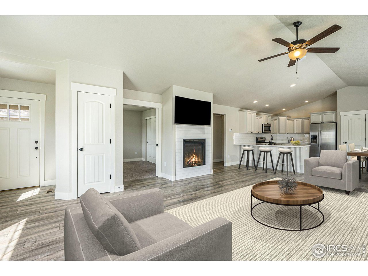 619 Davis Drive Frederick, CO 80530 - Photo 4 of 24 a living room with furniture and a fireplace