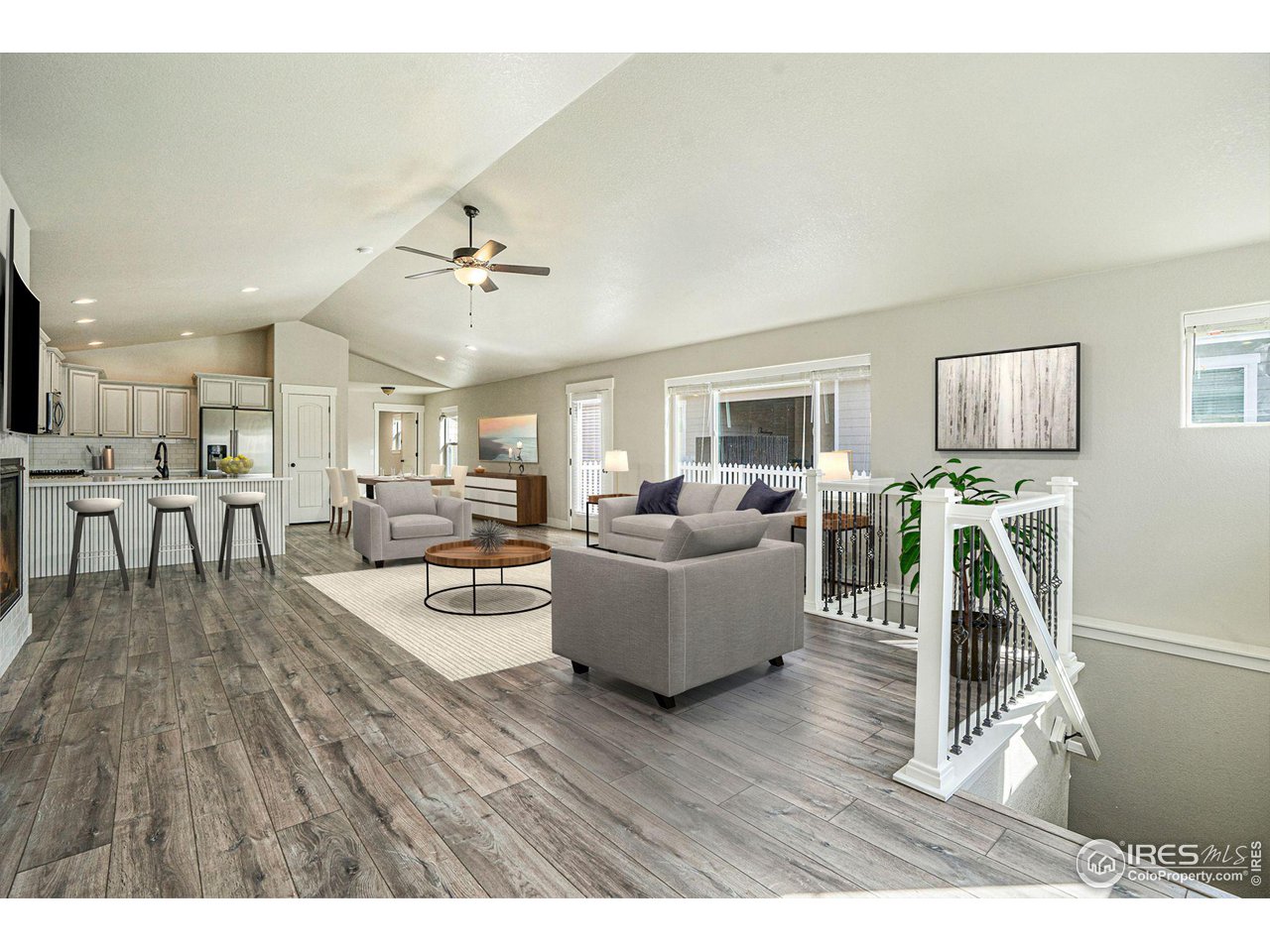 619 Davis Drive Frederick, CO 80530 - Photo 6 of 24 a living room with furniture wooden floor and a dining table