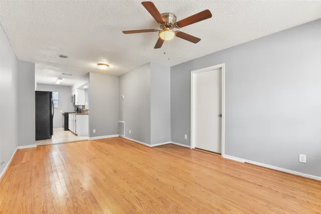 a view of a livingroom with a kitchen