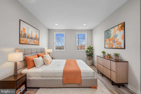 a bedroom with bed and window