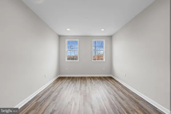 a view of room with window and hardwood floor