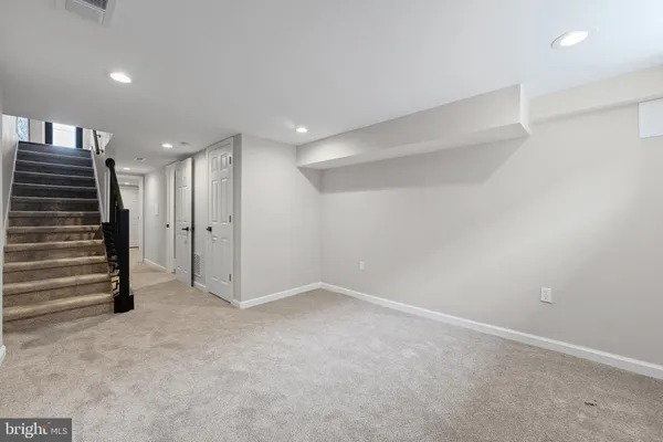 a view of an empty room with a hallway