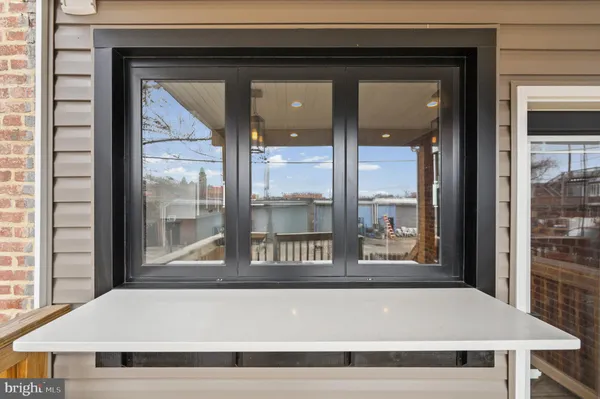 a living room with a large window and table