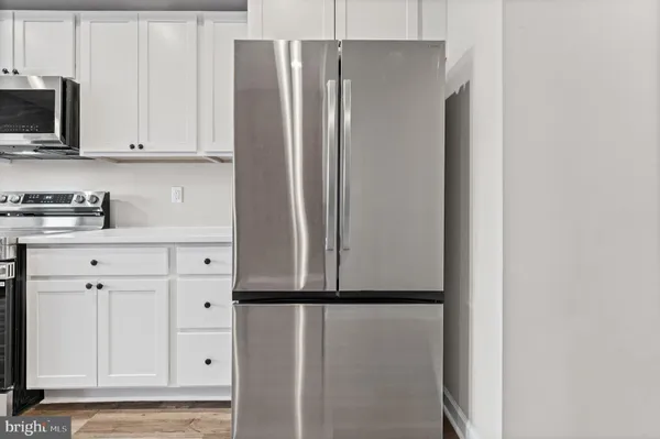 a view of cabinets with wooden floor