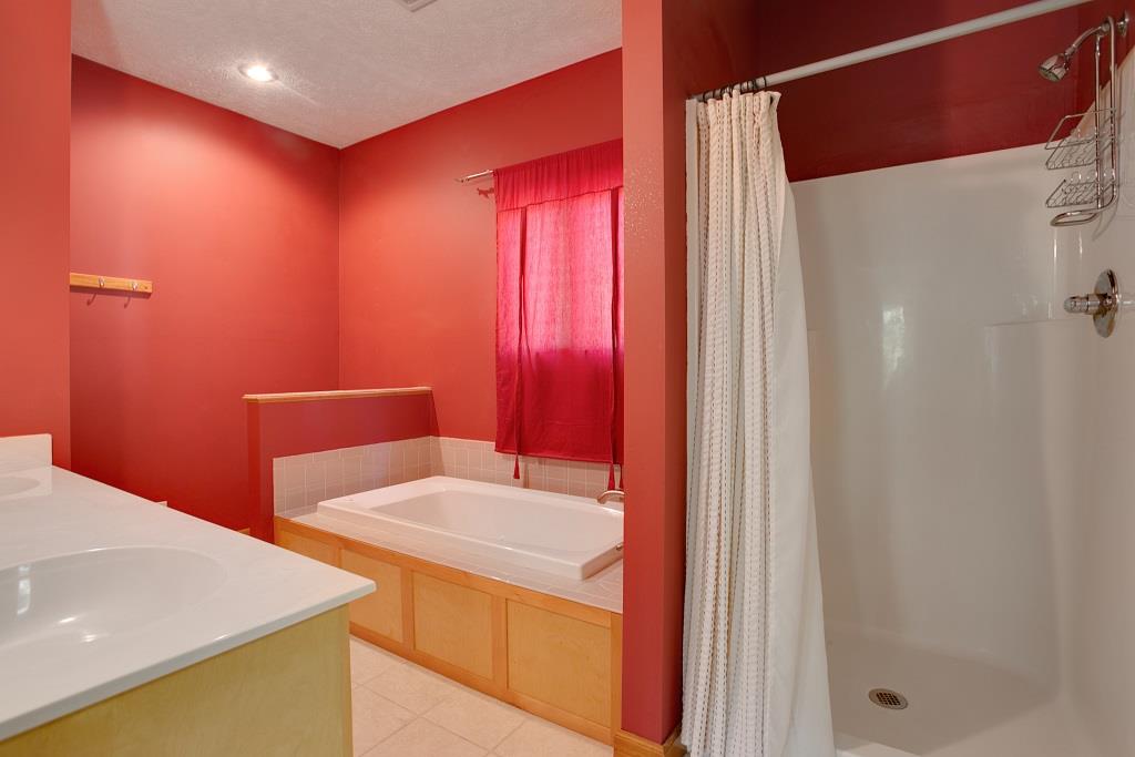 2144 Ridgeview Run Lynchburg, TN 37352 - Photo 17 of 29 a bathroom with a sink a mirror and a shower