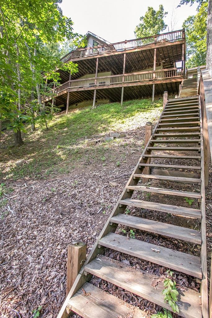 2144 Ridgeview Run Lynchburg, TN 37352 - Photo 29 of 29 a view of a backyard with chairs and wooden fence