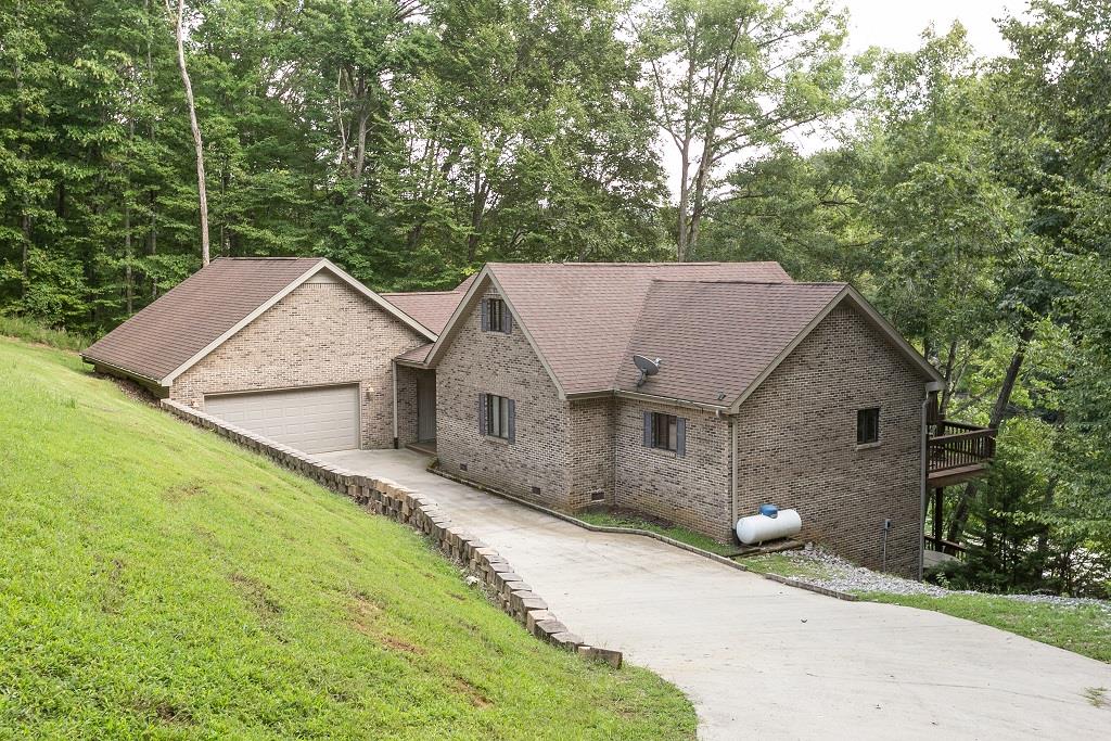 2144 Ridgeview Run Lynchburg, TN 37352 - Photo 3 of 29 a view of a house with a yard and large tree