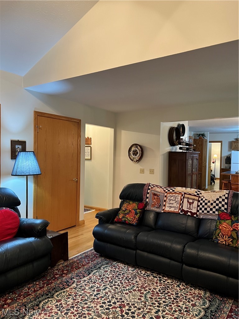 4583 Baldwin Road Kingsville, OH 44048 - Photo 3 of 35 Vaulted family room 18 x 14 with stone woodburning fireplace and hardwood floors.