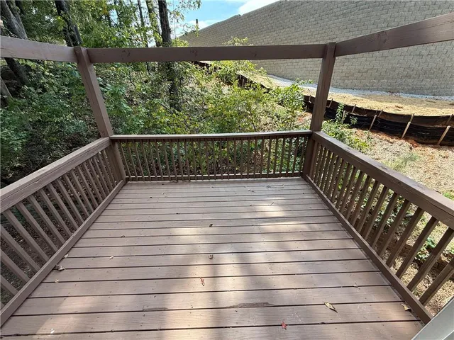 a view of balcony with wooden floor