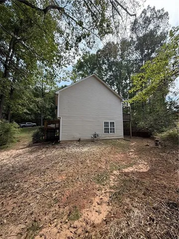 a house with trees in the background