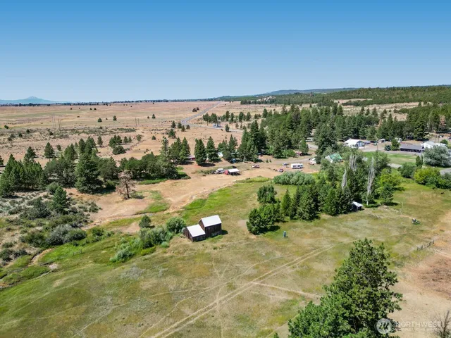 a living room with lots of furniture and a chandelier