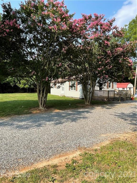 1027 Capps Road Bessemer City, NC 28016 - Photo 2 of 20 a view of a yard with a tree