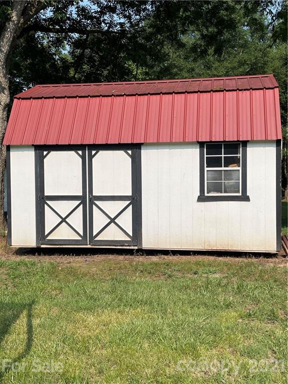 1027 Capps Road Bessemer City, NC 28016 - Photo 18 of 20 a view of a small space in a yard