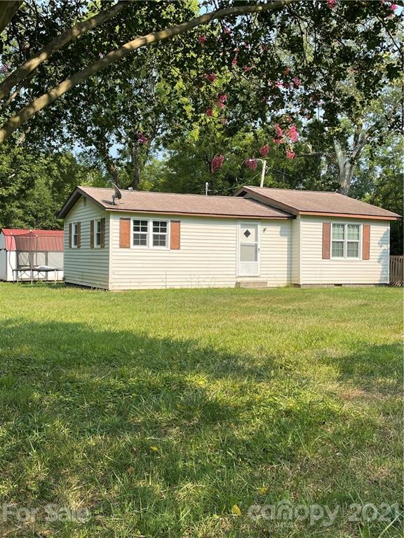 1027 Capps Road Bessemer City, NC 28016 - Photo 19 of 20 a house that has a tree in it