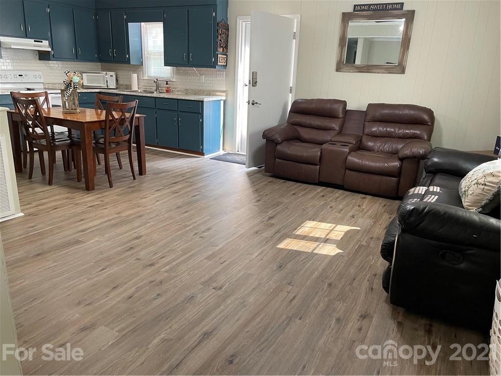 1027 Capps Road Bessemer City, NC 28016 - Photo 4 of 20 a living room with furniture and a wooden floor