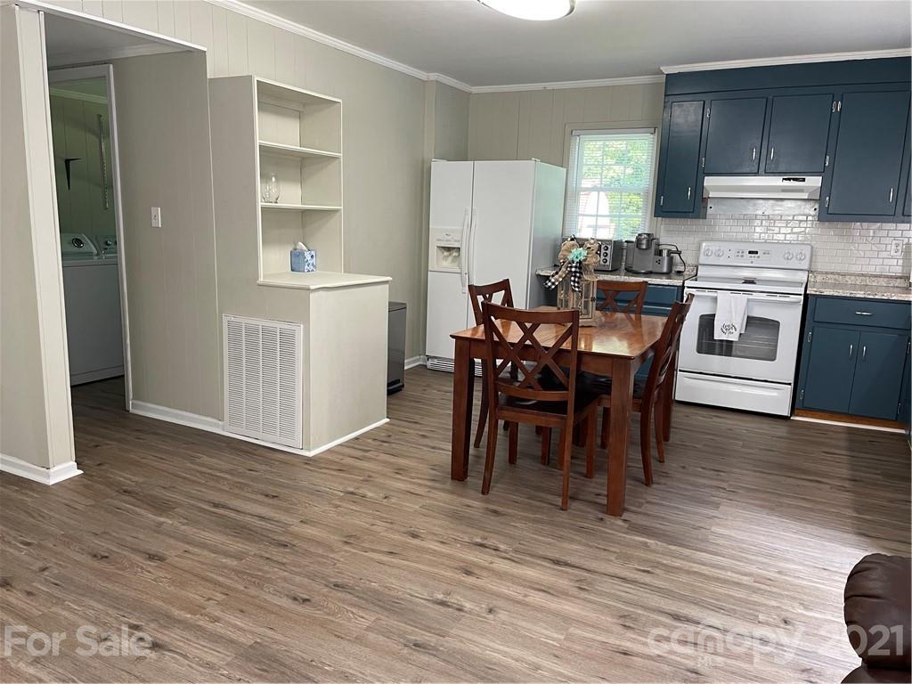 1027 Capps Road Bessemer City, NC 28016 - Photo 5 of 20 a view of a dining room with furniture and wooden floor