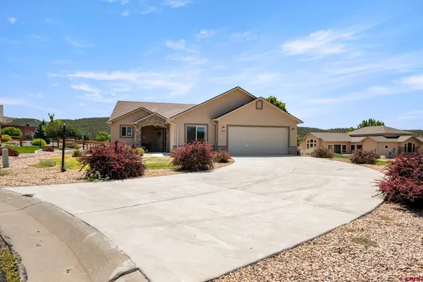 a front view of a house with a outdoor space