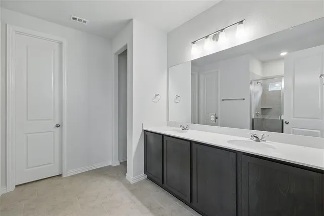 a view of room with ceiling fan and window