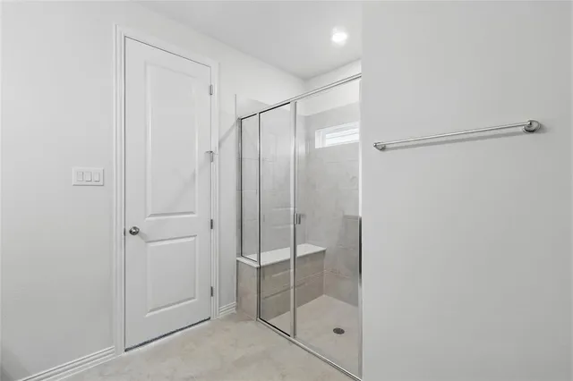 a bathroom with a double vanity sink and mirror