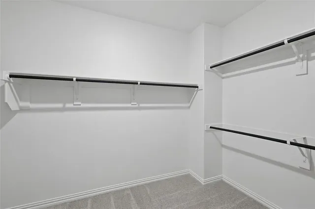 a bathroom with a double vanity sink and mirror