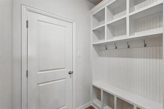 a view of an empty room with a ceiling fan