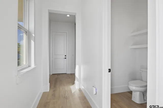 a view of a bathroom with a toilet and a shower
