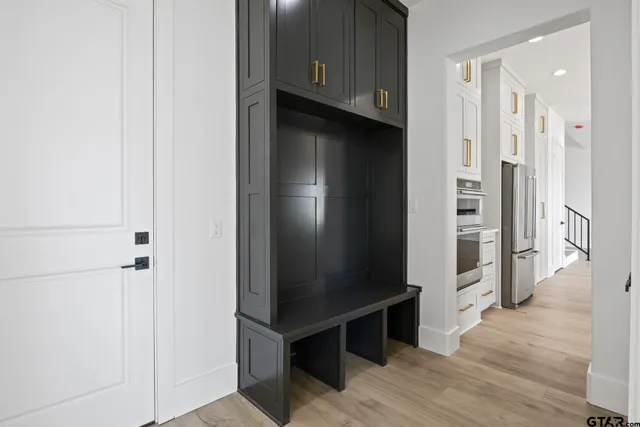 an empty room with wooden floor