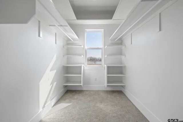 a view of an empty walk in closet