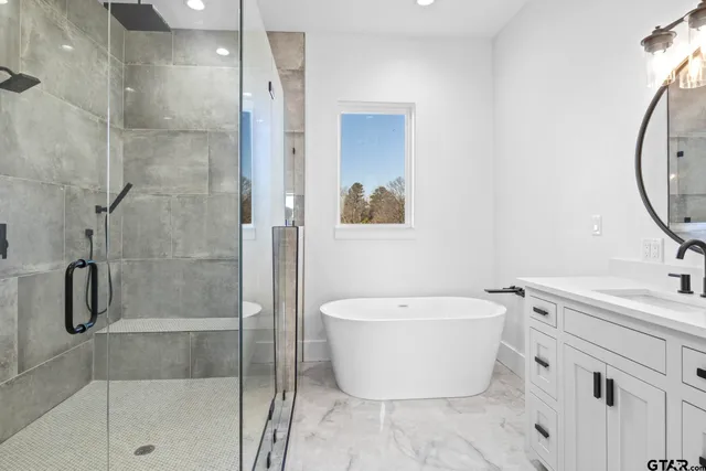 a bathroom with a white toilet and a shower