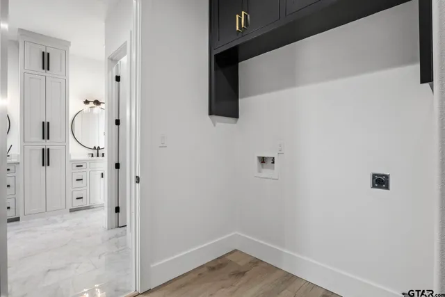 a bathroom with a granite countertop sink