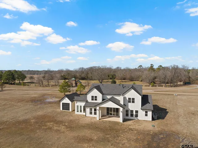 a view of a town with large trees