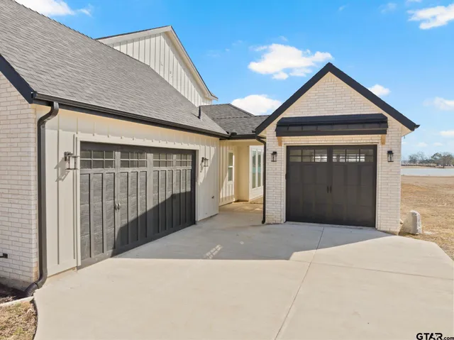 a front view of a house with a garage