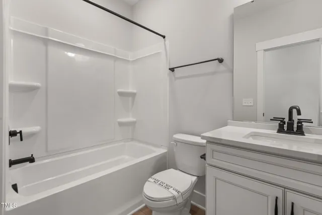 a view of a kitchen with wooden floor and a sink