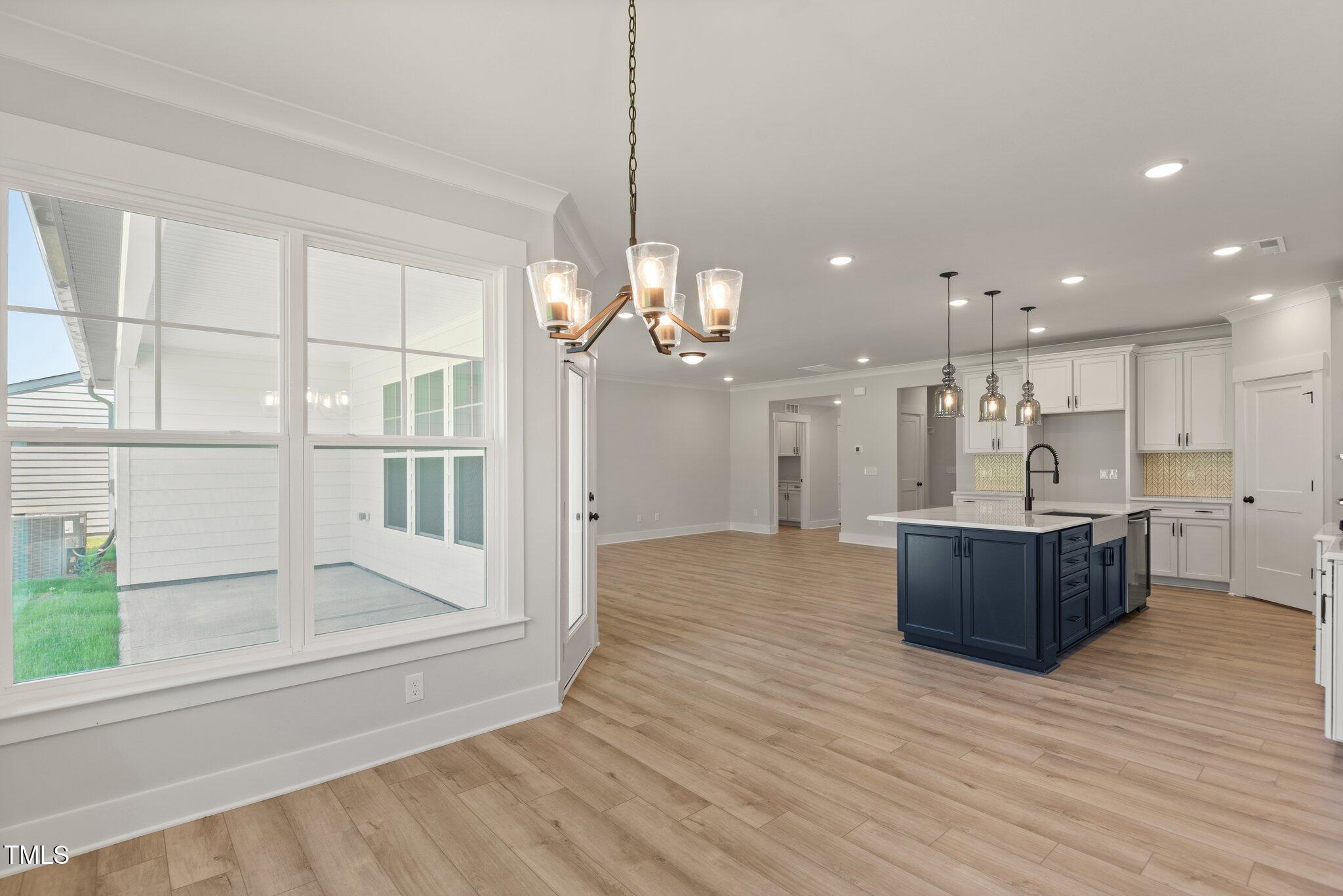 1306 Cricket Street Elon, NC 27244 - Photo 22 of 36 a view of a kitchen and dining room