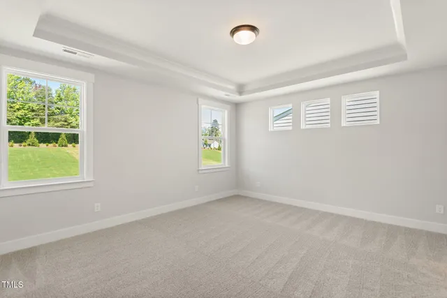 a view of an empty room and a window