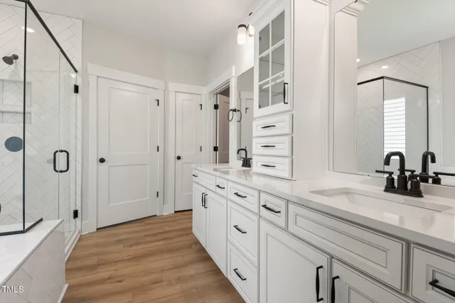 a bathroom with a bathtub shower and toilet