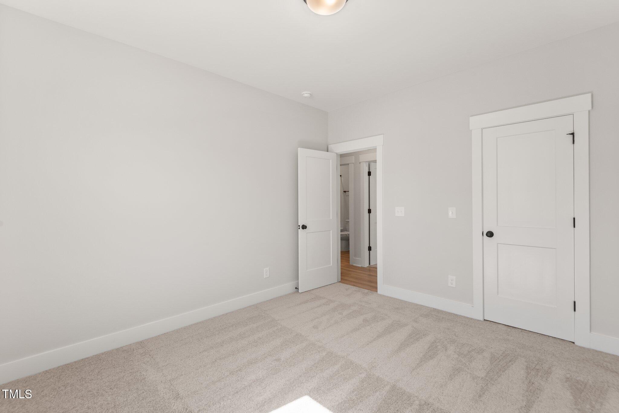 1306 Cricket Street Elon, NC 27244 - Photo 9 of 36 a view of an empty room