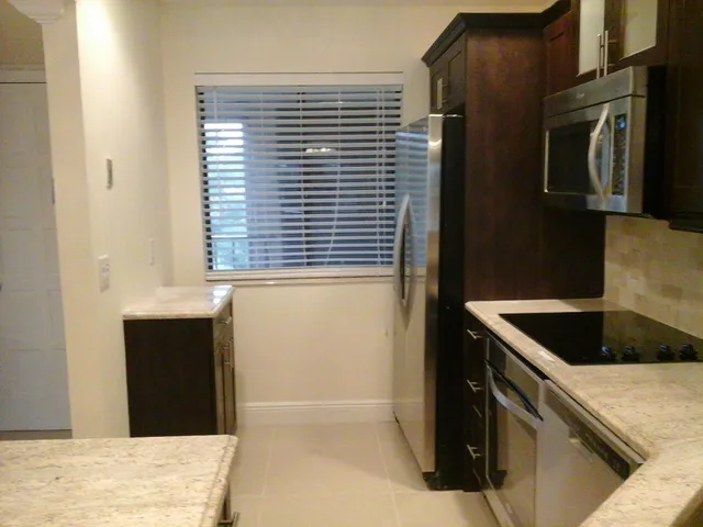 a kitchen with a cabinets and washing machine