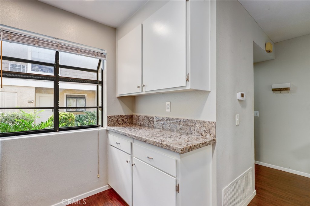 162 Pineview Irvine, CA 92620 - Photo 12 of 35 a view of a kitchen cabinets and wooden floor