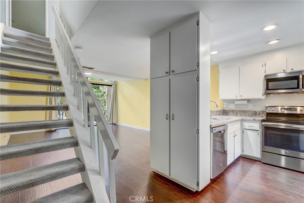 162 Pineview Irvine, CA 92620 - Photo 13 of 35 a view of a kitchen cabinets and wooden floor