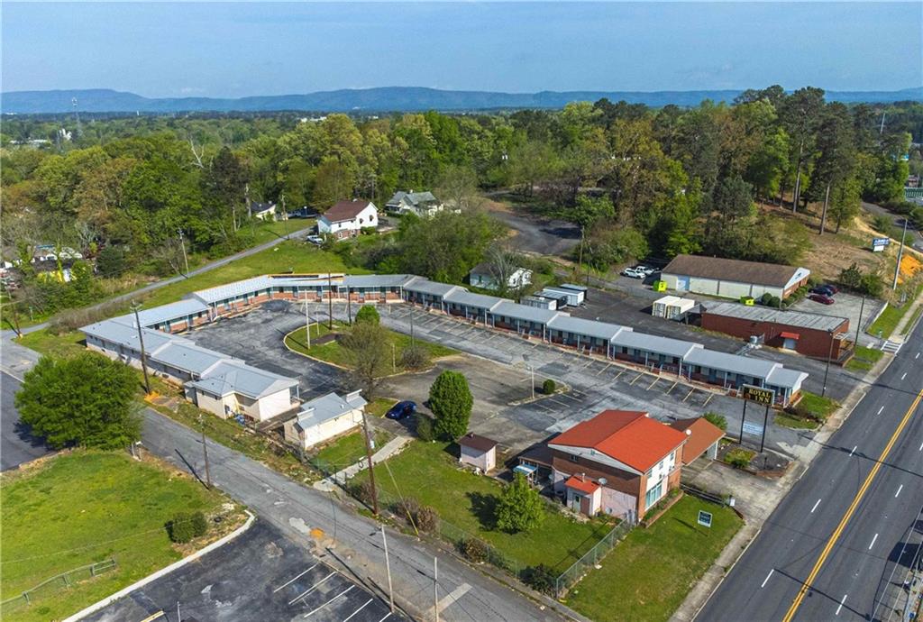 1201 Martha Berry Boulevard Northeast Rome, GA 30165 - Photo 4 of 10 an aerial view of a house with a garden and lake view